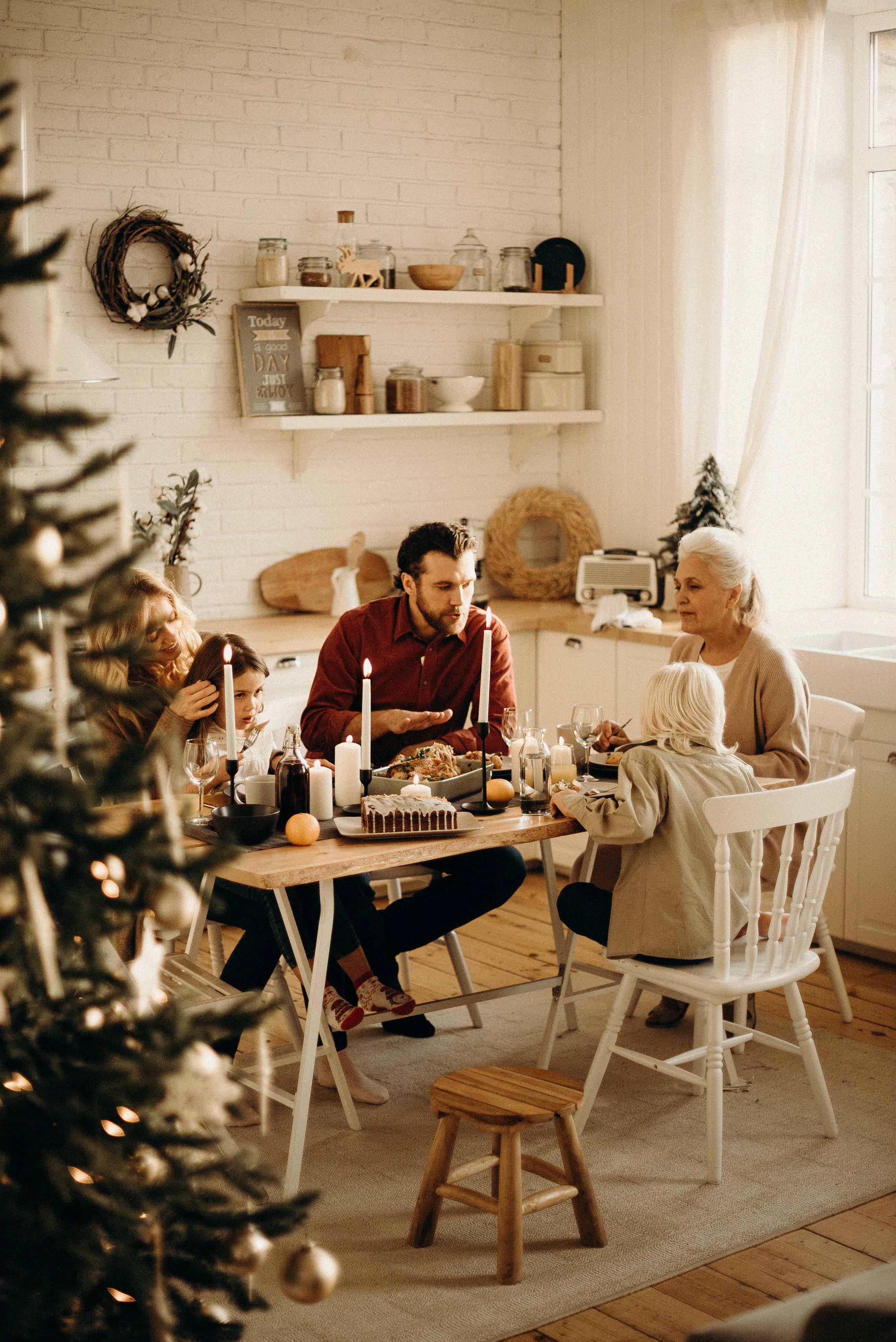 A family sits together for a holiday meal. 